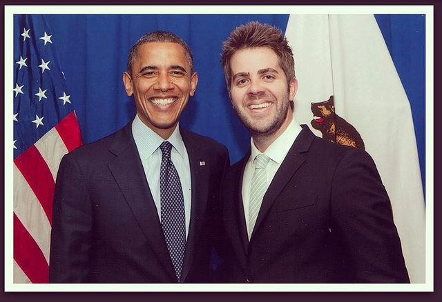Jordan C. Brown in noir suit with former President Barack Obama.